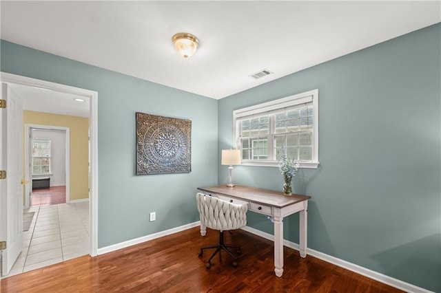 office space featuring hardwood / wood-style flooring and plenty of natural light