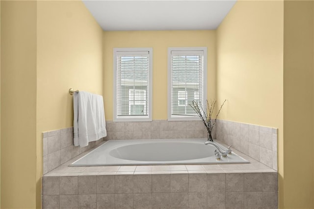 bathroom with tiled tub