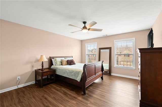 bedroom featuring dark hardwood / wood-style flooring and ceiling fan