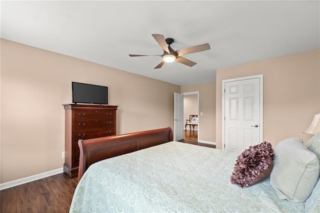 bedroom with dark wood-type flooring and ceiling fan