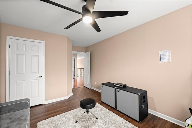 interior space featuring dark hardwood / wood-style flooring and ceiling fan