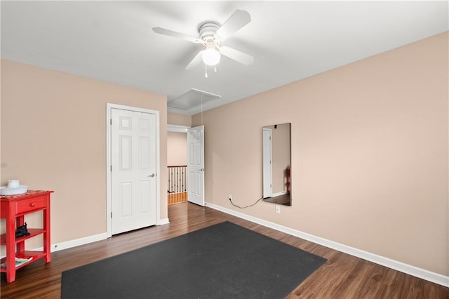 unfurnished bedroom featuring ceiling fan and dark hardwood / wood-style flooring