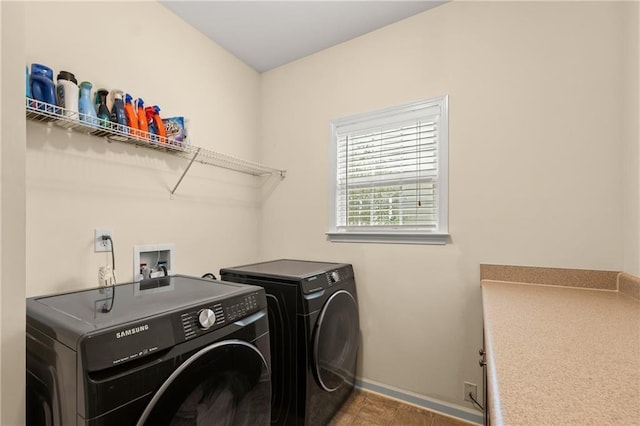 clothes washing area with washing machine and clothes dryer