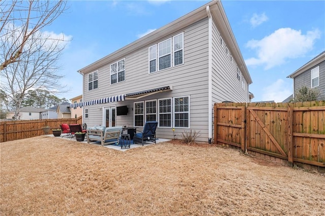 back of property with a patio and outdoor lounge area