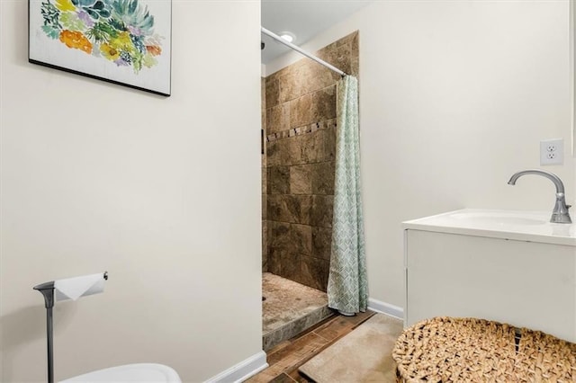 1630 Park Ln, Marietta, GA 30066 - full bath featuring a tile shower, wood finished floors, toilet, and vanity