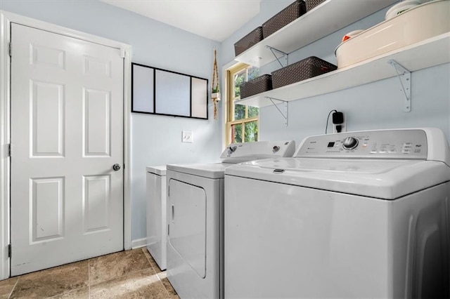 1630 Park Ln, Marietta, GA 30066 - laundry area featuring separate washer and dryer and light stone finish floors