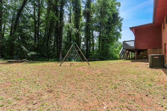1630 Park Ln, Marietta, GA 30066 - view of grassy yard featuring cooling unit, stairway, and a wooden deck
