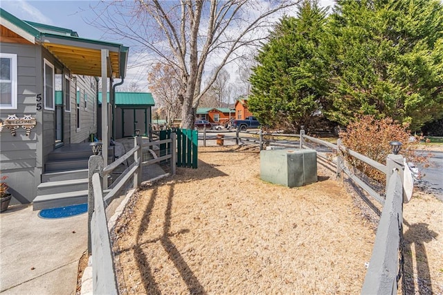 view of yard with a shed, an outdoor structure, and fence