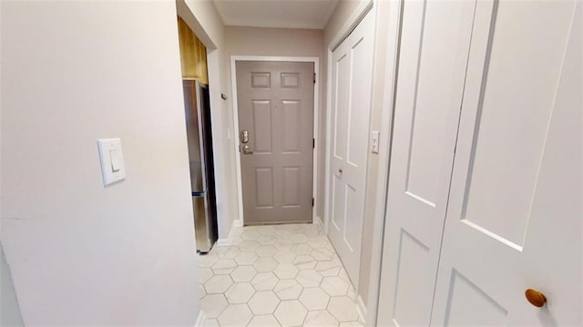 hall with light tile patterned flooring