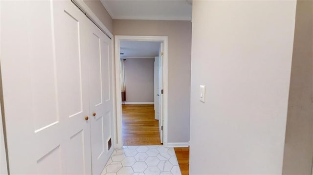 hallway with light hardwood / wood-style floors