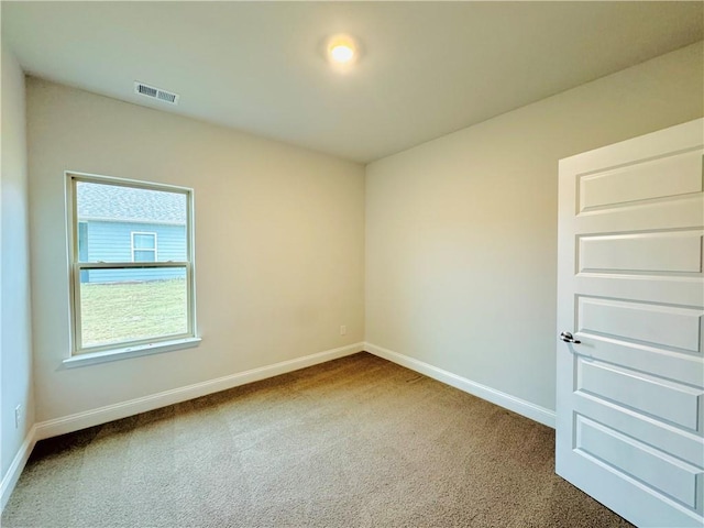 spare room with carpet floors