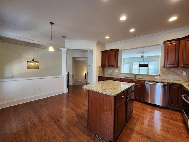 kitchen with a center island, dark wood finished floors, stainless steel dishwasher, a sink, and ornate columns