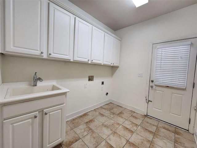 clothes washing area featuring cabinet space, baseboards, hookup for a washing machine, hookup for an electric dryer, and a sink