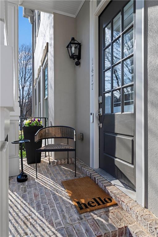 entrance to property with stucco siding