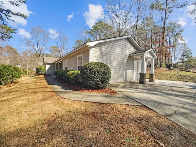 view of side of property with driveway