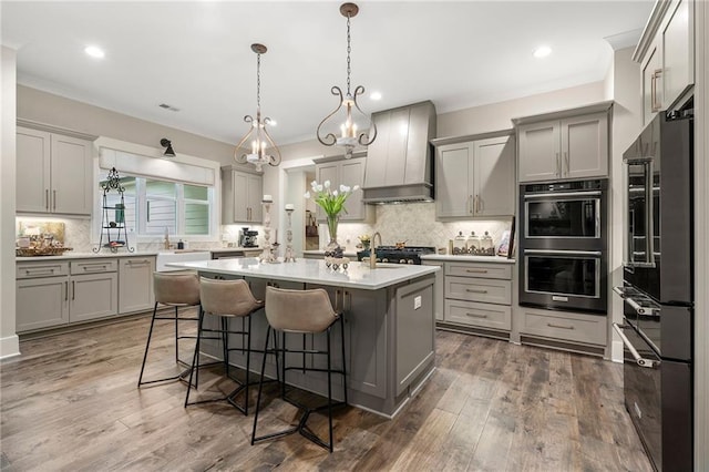 131 Forsyth Park Ln, Woodstock, GA 30188 - kitchen with premium range hood, high end fridge, gray cabinets, decorative backsplash, and recessed lighting