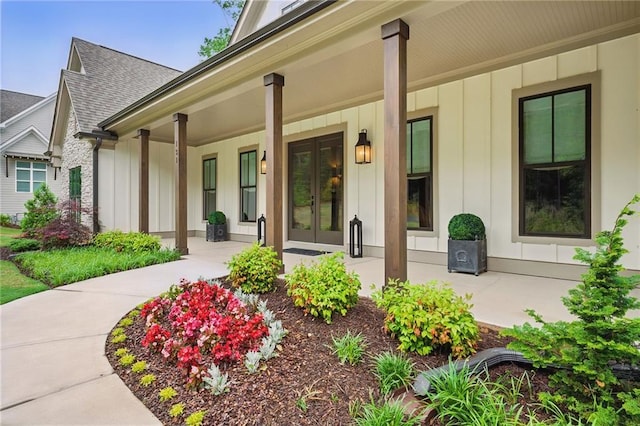 131 Forsyth Park Ln, Woodstock, GA 30188 - property entrance with board and batten siding, a porch, french doors, and roof with shingles