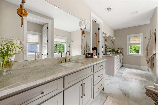 131 Forsyth Park Ln, Woodstock, GA 30188 - bathroom with vanity, marble finish flooring, and baseboards