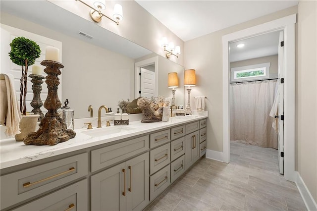 131 Forsyth Park Ln, Woodstock, GA 30188 - full bathroom with double vanity and baseboards