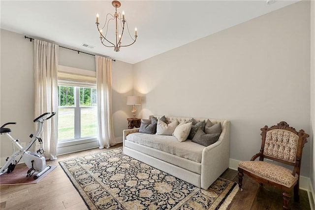 131 Forsyth Park Ln, Woodstock, GA 30188 - living area with a chandelier, wood finished floors, and baseboards