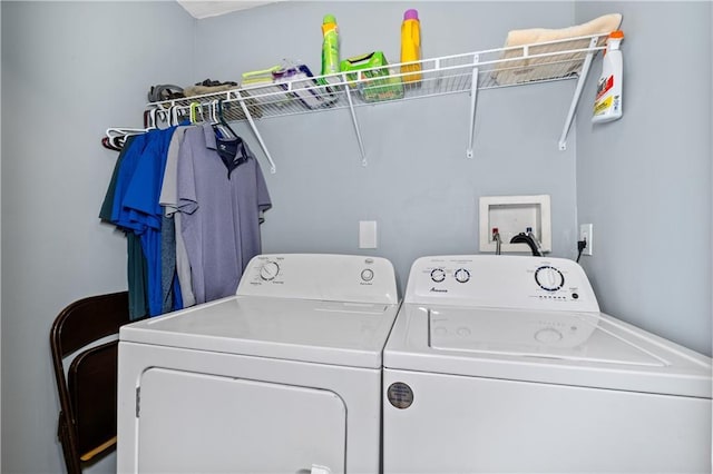 laundry area featuring washing machine and dryer and laundry area