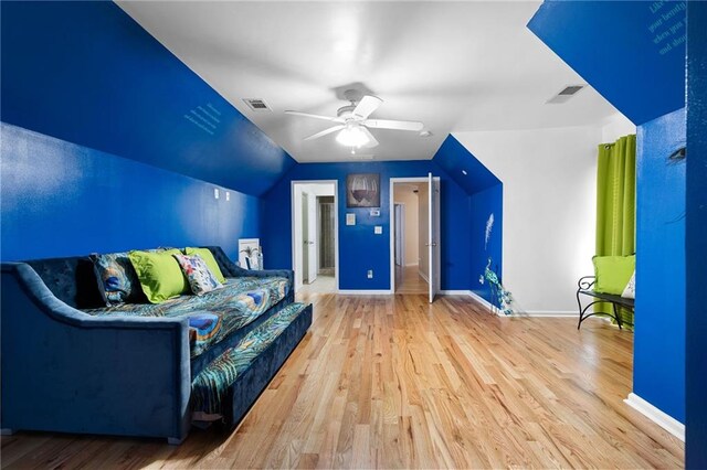 additional living space featuring wood finished floors, visible vents, and a ceiling fan