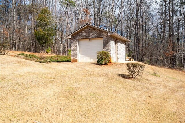 garage with dirt driveway