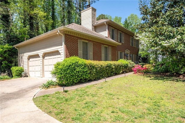 4140 Westchester Xing NE, Roswell, GA 30075 - view of side of home with a chimney, driveway, an attached garage, brick siding, and a yard