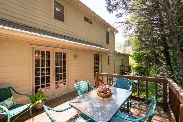 4140 Westchester Xing NE, Roswell, GA 30075 - wooden terrace featuring french doors and outdoor dining space