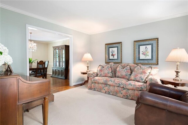 4140 Westchester Xing NE, Roswell, GA 30075 - living area featuring carpet flooring, a notable chandelier, ornamental molding, and baseboards