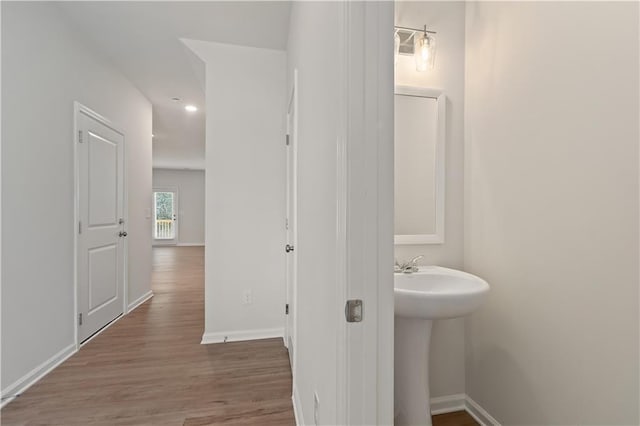 bathroom with wood-type flooring