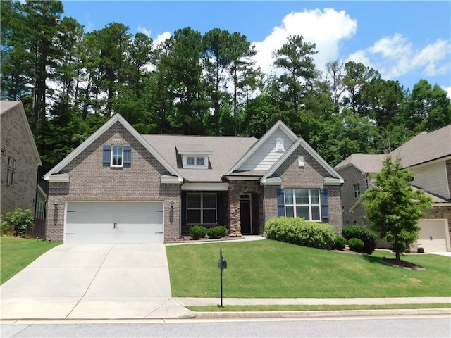 330 La Perla Dr, Sugar Hill, GA 30518 - craftsman-style house with brick siding, driveway, an attached garage, and a front yard