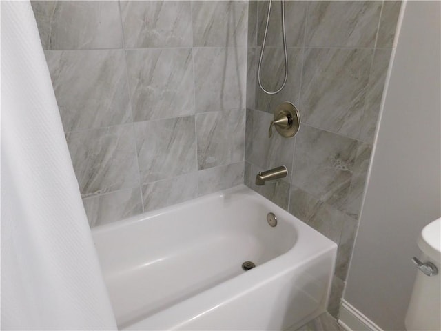 330 La Perla Dr, Sugar Hill, GA 30518 - bathroom with shower / tub combo and toilet