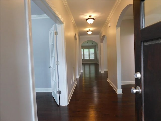 330 La Perla Dr, Sugar Hill, GA 30518 - hall with arched walkways, dark wood-style floors, and crown molding