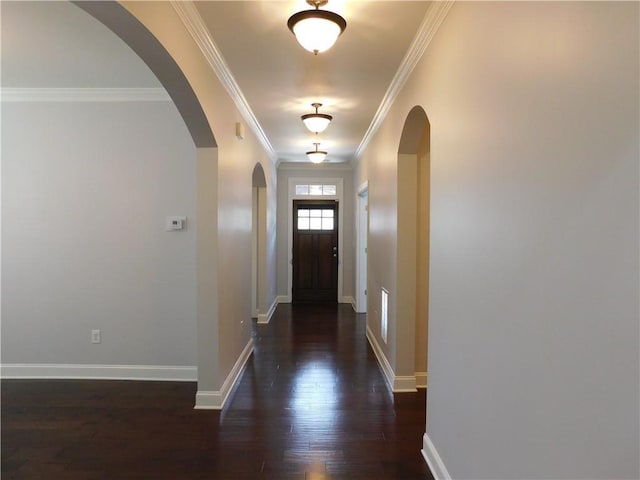 330 La Perla Dr, Sugar Hill, GA 30518 - entrance foyer featuring arched walkways, dark wood finished floors, and ornamental molding