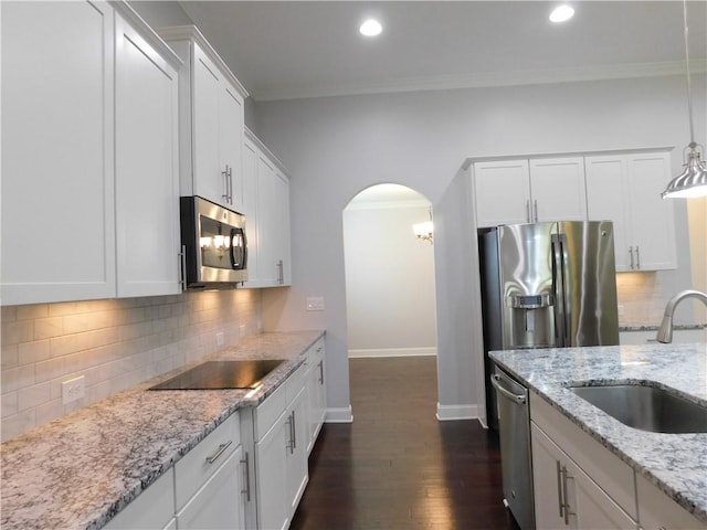 330 La Perla Dr, Sugar Hill, GA 30518 - kitchen featuring stainless steel appliances, arched walkways, dark wood-style flooring, white cabinetry, and recessed lighting