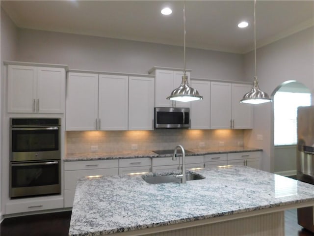 330 La Perla Dr, Sugar Hill, GA 30518 - kitchen featuring appliances with stainless steel finishes, white cabinetry, tasteful backsplash, recessed lighting, and ornamental molding