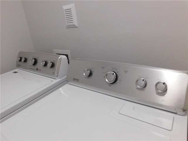 330 La Perla Dr, Sugar Hill, GA 30518 - laundry area with washer and clothes dryer