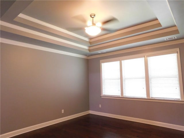 330 La Perla Dr, Sugar Hill, GA 30518 - unfurnished room with a tray ceiling, ceiling fan, dark wood finished floors, and ornamental molding