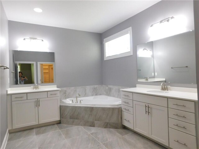 330 La Perla Dr, Sugar Hill, GA 30518 - full bathroom featuring two vanities and a bath