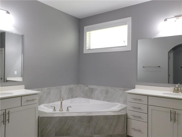 330 La Perla Dr, Sugar Hill, GA 30518 - full bath with two vanities and a garden tub