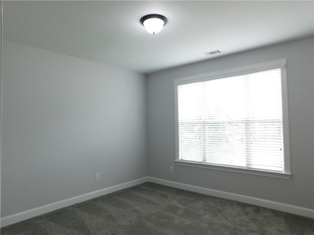 330 La Perla Dr, Sugar Hill, GA 30518 - spare room featuring dark colored carpet and baseboards