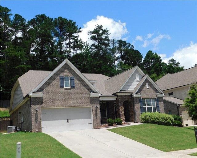 330 La Perla Dr, Sugar Hill, GA 30518 - view of front facade featuring brick siding, driveway, and a front yard