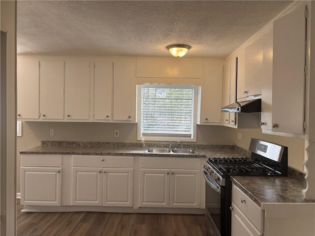 kitchen with stainless steel range with gas cooktop, white cabinetry, sink, dark hardwood / wood-style flooring, and a textured ceiling