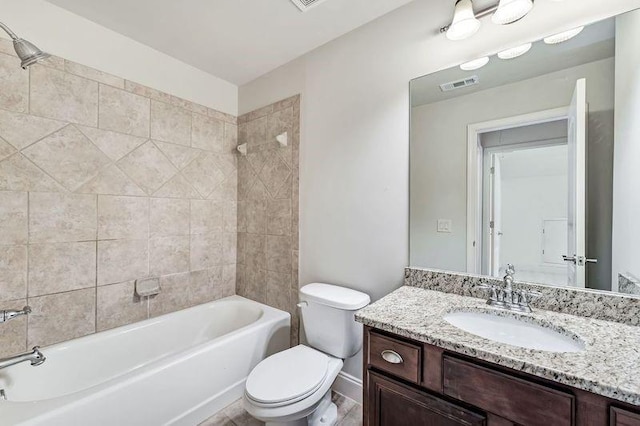 full bathroom with vanity, toilet, and tiled shower / bath