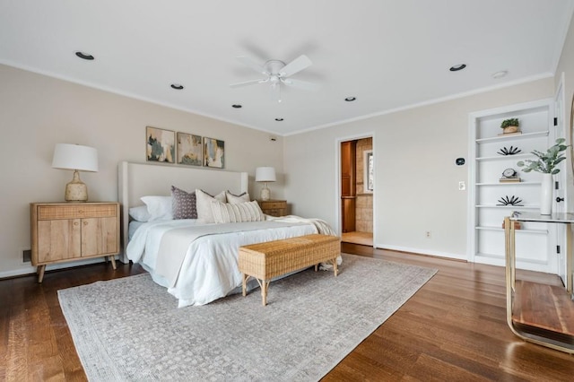 bedroom with dark wood-style floors, recessed lighting, baseboards, and crown molding