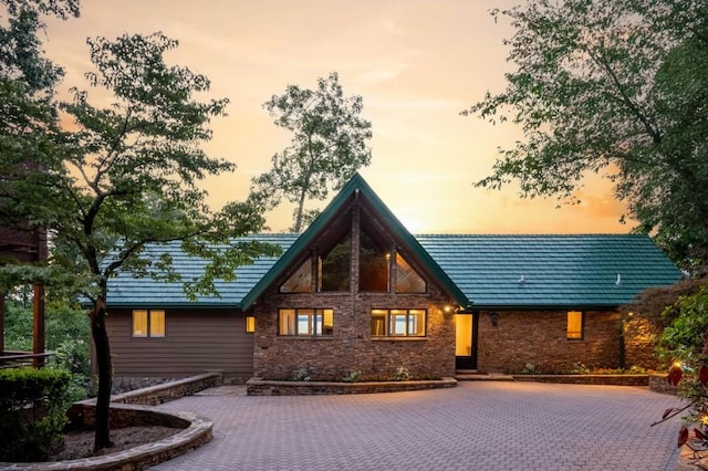 view of back of property at dusk