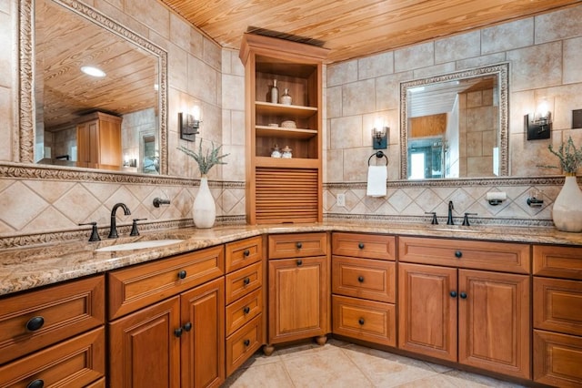 full bath with wooden ceiling, a sink, backsplash, and double vanity