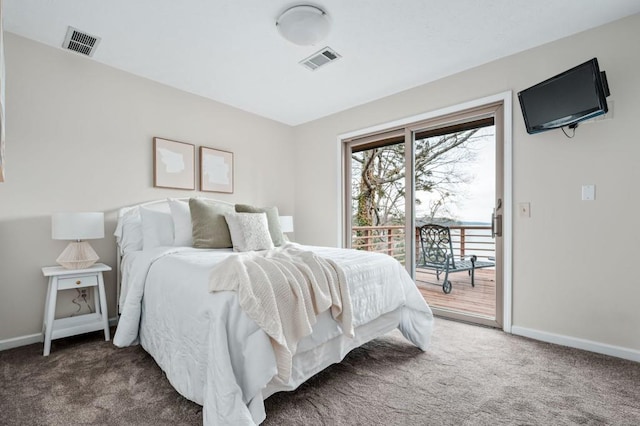 bedroom with access to outside, visible vents, dark colored carpet, and baseboards