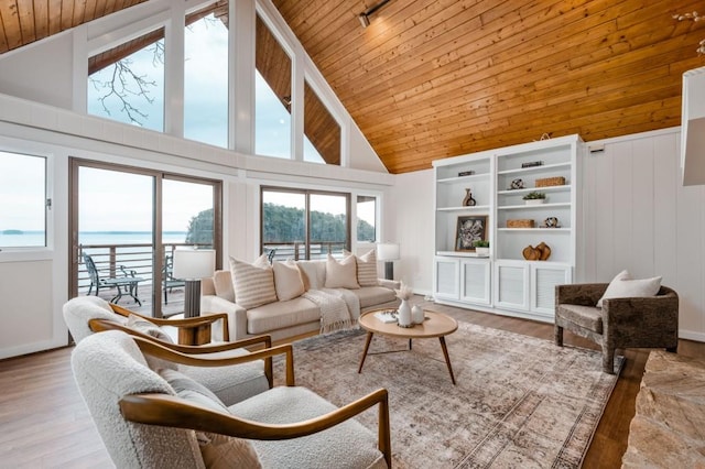 living room with high vaulted ceiling, wooden ceiling, a water view, and wood finished floors